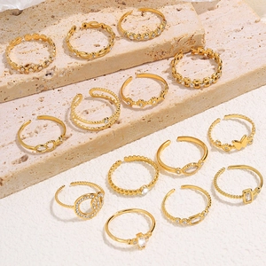 Elegant gold butterfly and zircon stainless steel open rings set on a marble stone