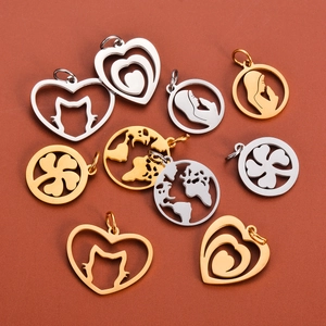 Various hollow stainless steel charms in gold and silver finish on a solid background