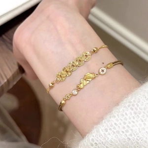Gold plated koi carp bracelet set with cubic zirconia in a vintage Chinese style