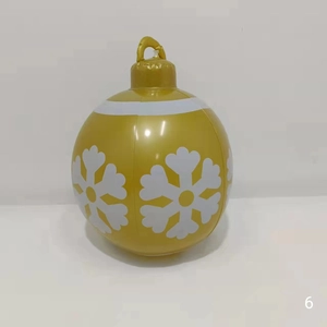 Close-up of a 60cm golden PVC inflatable Christmas ball with white snowflake prints