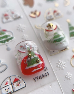 Macro shot of 3D embossed Christmas nail art stickers featuring YT4441 tree and snowman