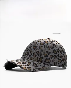 Detail of grey leopard print baseball cap with distressed brim and breathable eyelets