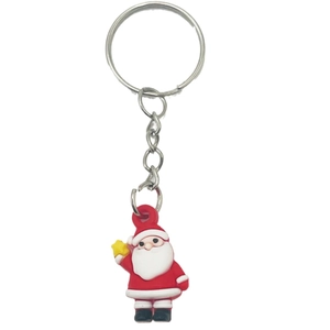 Mini cartoon Santa Claus keychain in red silicone holding a yellow star on white background
