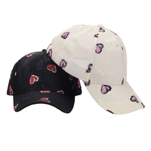 Fashionable heart embroidered baseball cap in black and cream jacquard fabric