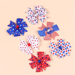 Detailed set of six patriotic ribbon hair bows featuring US flag stars and stripes patterns