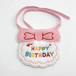 Detailed view of pink birthday pet bib with Happy Birthday embroidery and soft plush fabric