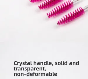 Detail of crystal handle eyelash brushes with solid transparent stem and spiral brush head