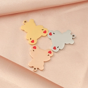 Three bear charms in gold, silver and rose gold with red hearts on pink satin