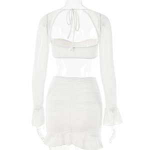 Detailed back view of white two-piece set featuring cut-out tie-back and flared sleeves