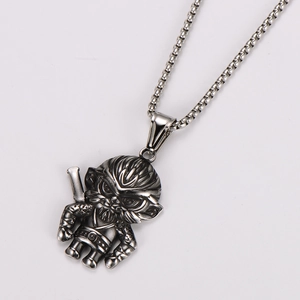 Macro shot of silver stainless steel Sun Wukong pendant with detailed armor and metal chain