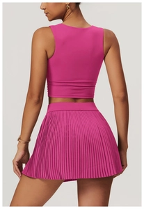 Detail of the racerback design on a hot pink athletic yoga tank top for women