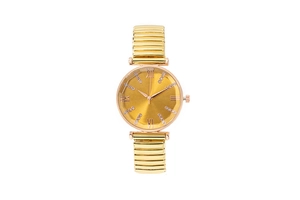 Close-up of faceted glass dial and elastic metal strap on a gold Roman numeral watch