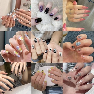 Collage of diverse handmade press-on nails featuring various colors and 3D cross charms
