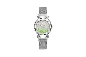 Detail of silver-green star dial with mesh band and diamond-cut bezel on quartz watch