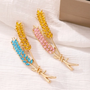 Elegant wheat stalk brooch set with colorful rhinestones on a gold metal base