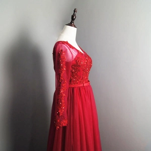 Elegant red V-neck evening gown with lace embroidery and layered tulle skirt