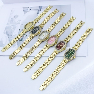 Detail of six quartz watches with rhinestone bezels and metal bands in various colors