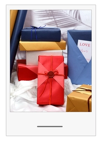 Elegant gift boxes with ribbons and Love You card against a textured white backdrop