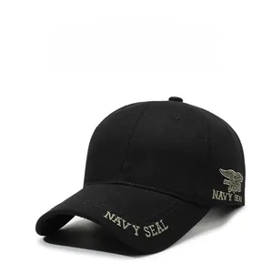 Detail of gold Navy Seal embroidery and trident logo on a black military baseball cap