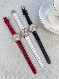 Three elegant quartz watches with diamond bezels and crocodile pattern leather straps
