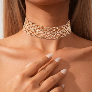 Elegant gold choker necklace with geometric rhinestone mesh pattern for women in close-up shot