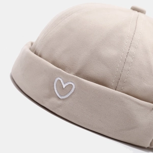 Stylish khaki docker hat with white heart embroidery for street style look