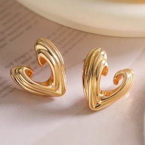 Elegant 18k gold plated geometric heart stud earrings with a 3D relief texture design