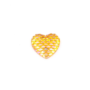 Macro shot of 16mm heart-shaped resin cabochon with iridescent gold fish scale texture
