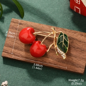 Detail view of cherry brooch dimensions showing 3.66cm length and red enamel finish