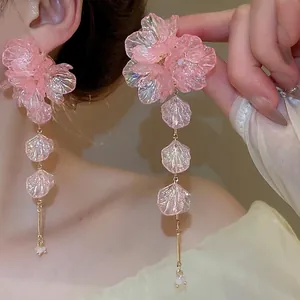 Pink floral tassel earrings with gold chains and resin petals for a romantic sweet style