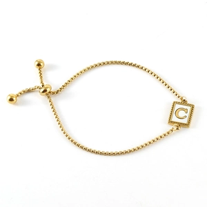 Adjustable golden stainless steel bracelet with shell letter C pendant on white background