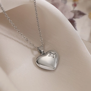Minimalist silver heart pendant necklace with star zircon accent on champagne silk
