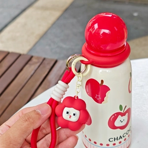 Close-up of CHACOO apple-themed thermos with a red flower silicone pendant and lanyard