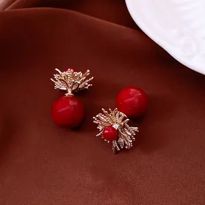 Retro 18k gold plated flower stud earrings with red pearls on elegant red silk