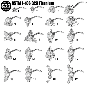 Set of 19 G23 Titanium L-shaped nose studs with sparkling zircon stones on white background