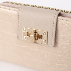 Beige crocodile embossed leather long wallet with a gold square twist lock closure