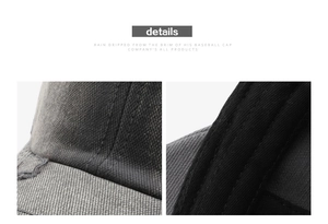 Close-up of distressed charcoal cotton baseball cap showing frayed edges and vintage textures