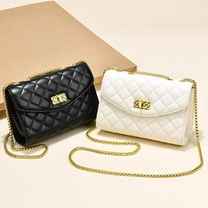 Classic quilted crossbody bag with gold chain strap in black and white leather style