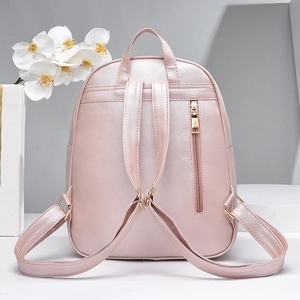 Pink Saffiano leather backpack with metallic finish and gold hardware for women