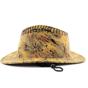 Detail of tan camouflage western cowboy hat with black stitching and adjustable chin strap