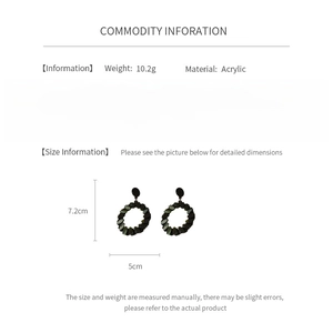 Detail view of black acrylic geometric earrings with size 7.2x5cm and 10.2g weight specs