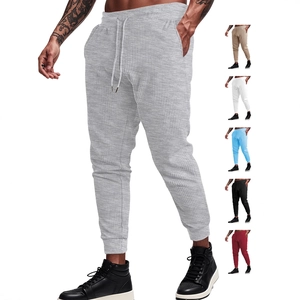 Men's waffle knit drawstring joggers with tapered cuffs in versatile solid colors