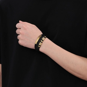 Men's multilayer braided black leather bracelet with gold stainless steel plate on wrist