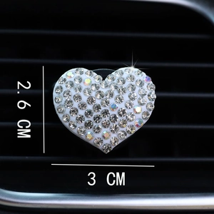 Close-up of heart-shaped crystal car air vent clip with precise 3x2.6 cm dimensions