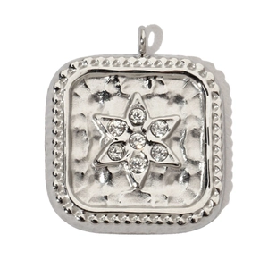 Detail of silver square pendant with hammered texture and zircon star inlay