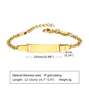 Macro detail of adjustable gold stainless steel baby ID bracelet with engraving bar