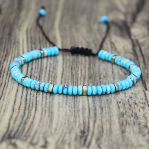 Handmade sky blue stone bead bracelet with gold square spacers and adjustable black cord