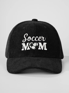 Close-up of black corduroy baseball cap featuring white Soccer MOM heart embroidery