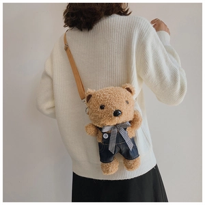 Rear view of model wearing a cute plush bear crossbody bag with denim overalls and checkered tie