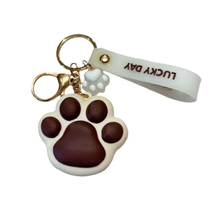 Cute cartoon cat paw keychain with Lucky Day wrist strap and golden metal clasp hardware